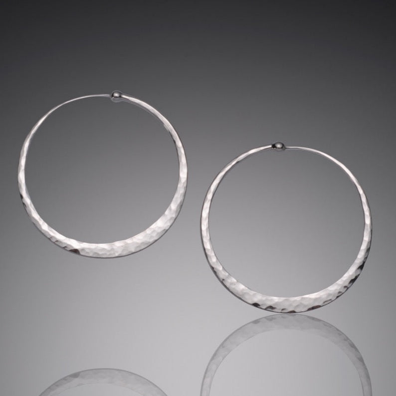 Hammered sterling silver hoop earrings from the Mostly Sweet Jewelry Hoop Collection